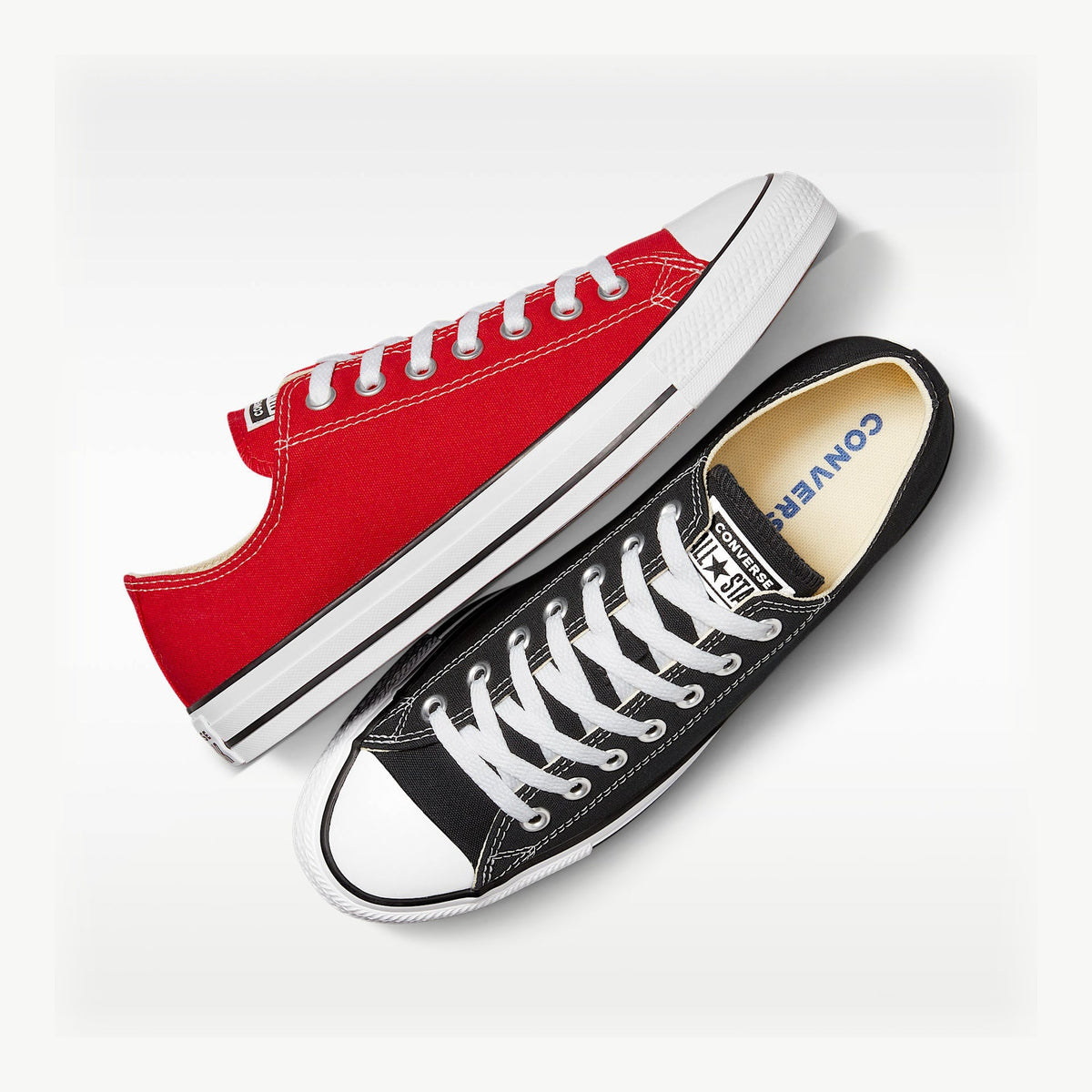 DROP 001 red and black Converse Chuck Taylor All Star Low mismatched pair — illustrative configuration A